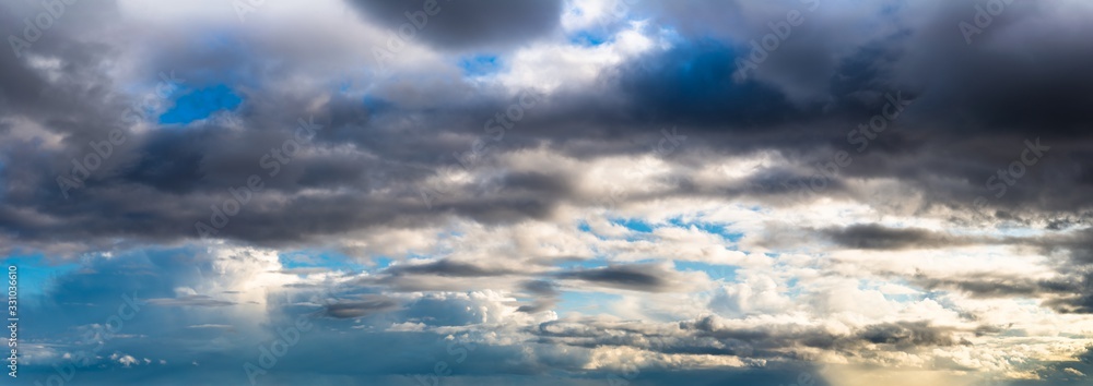 Fototapeta premium Fantastic dark thunderclouds at sunrise