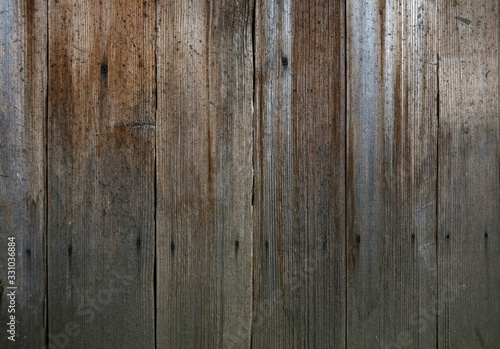 Vintage wooden panel with vertical planks and gaps