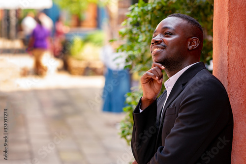 African businessman in suit thinking about business plan © arrowsmith2