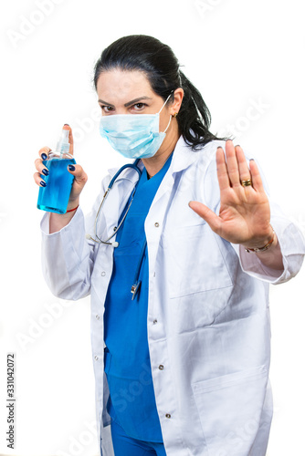 Stop  Doctor with mask and  disinfectant bottle