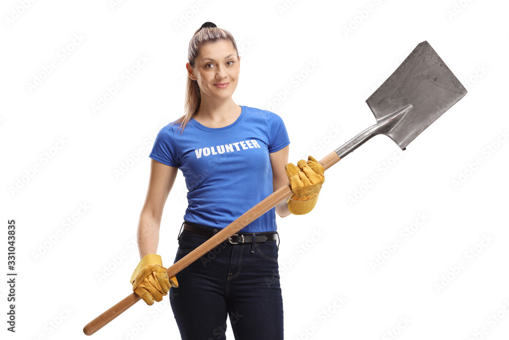 Young woman volunteer holding a shovel Young woman volunteer holding a shovel