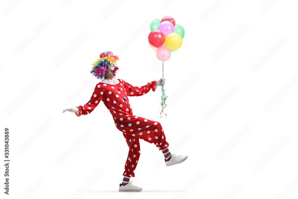 Clown walking carefully with a bunch of balloons