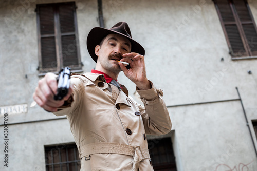 Fotografija Hitman pointing the gun to the camera, execution concept