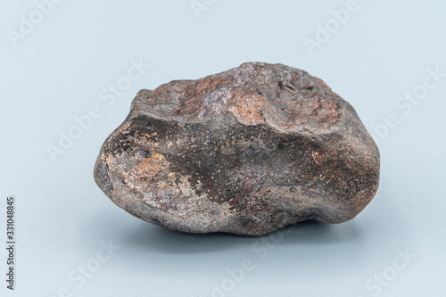 Chondrite Meteorite L6W2 Type isolated, piece of rock formed as an asteroid in the universe at during Solar System creation. The meteorite comes from an asteroid fall impacting Earth at Atacama Desert photo