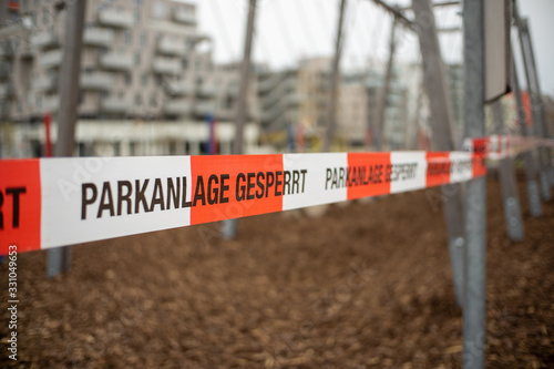 Vienna, Austria - 03.17.2020 Playground closed due due Corona virus crisis. German words „Parkanlage gesperrt“ means Playground is closed. photo