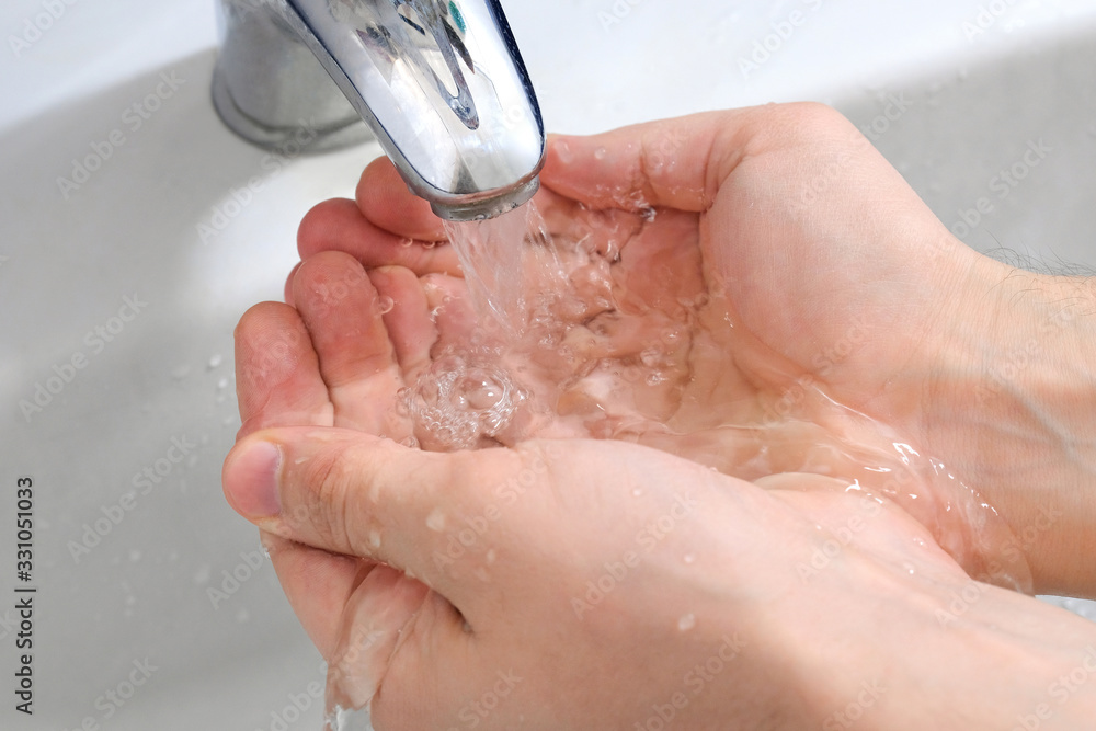 Wash hands with soap under the tap with water. Hygiene concept. Wash hands with soap under the tap with water. Hygiene concept.