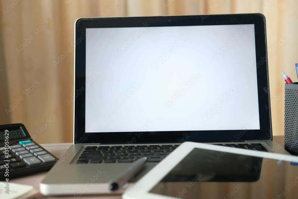 laptop with white screen on office table laptop with white screen on office table
