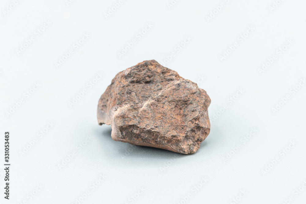 Obraz premium Chondrite Meteorite L6W2 Type isolated, piece of rock formed as an asteroid in the universe at during Solar System creation. The meteorite comes from an asteroid fall impacting Earth at Atacama Desert
