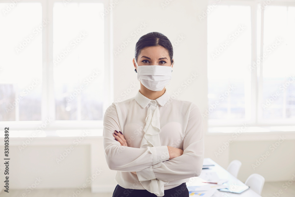 Danger of infection of the virus coronavirus infection. Businesswoman in medical mask at office - obrazy, fototapety, plakaty 