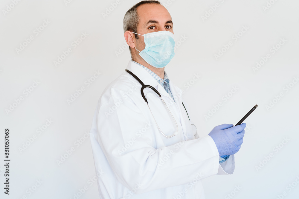 caucasian doctor using protective gloves, mask and mobile phone. Chinese Corona virus concept. 2019-nCoV caucasian doctor using protective gloves, mask and mobile phone. Chinese Corona virus concept. 2019-nCoV