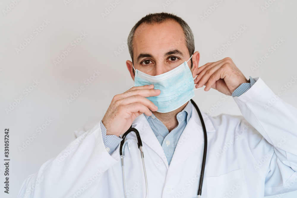doctor man wearing protective mask and gloves indoors. Corona virus concept doctor man wearing protective mask and gloves indoors. Corona virus concept