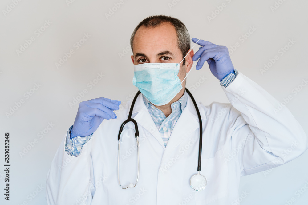 doctor man wearing protective mask and gloves indoors. Corona virus concept doctor man wearing protective mask and gloves indoors. Corona virus concept