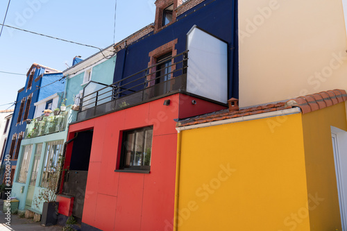 different colors houses in fisherman village of Trentemoult city Nantes France photo