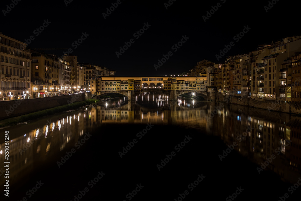 Nighttime view of Ponte Vecchio and River Arno, Tuscany, Italy