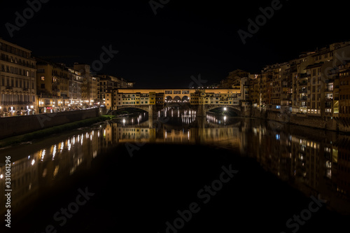 Nighttime view of Ponte Vecchio and River Arno, Tuscany, Italy © Annee