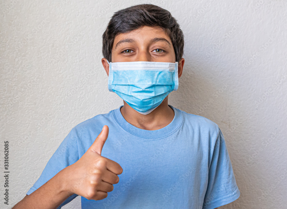 great boy with blue shirt preventing corona virus great boy with blue shirt preventing corona virus