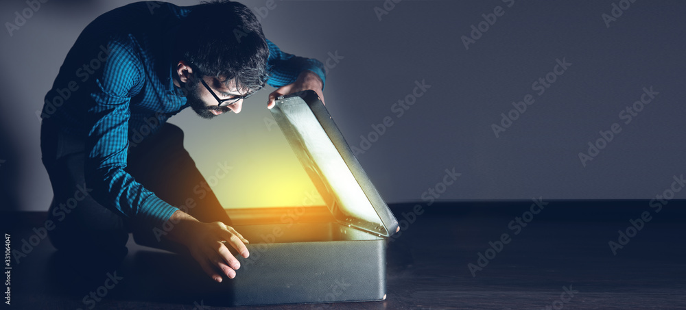 man open gift box on dark background - obrazy, fototapety, plakaty 