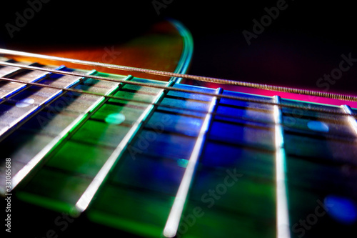 acoustic guitar in the ray of stage light 