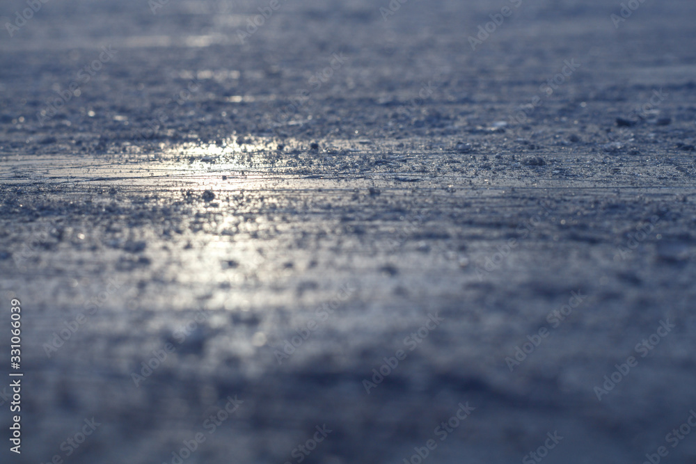 Traces of blades on an ice rink, selective focus.