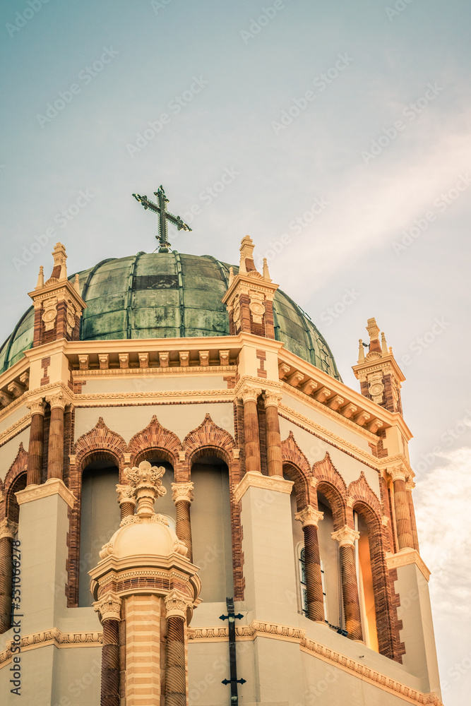 Fototapeta premium Cross on Green Roof of Ornate Church
