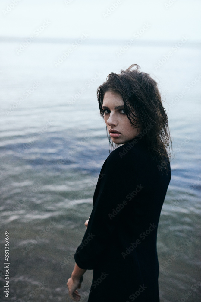 natural photo of an elegant girl walking by the beach, fashion session in natural light natural photo of an elegant girl walking by the beach, fashion session in natural light