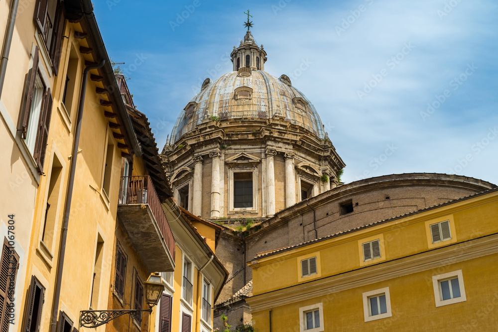 Rome street with view of the dome of Sant'Andrea della Valle. Сhurch in Italy.