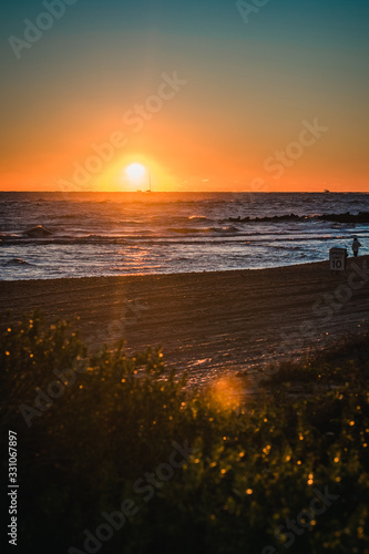 Sun Rising Over the Horizon Over the Ocean