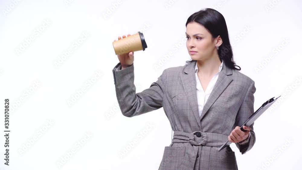 Businesswoman with clipboard and disposable cup of coffee isolated on white Businesswoman with clipboard and disposable cup of coffee isolated on white
