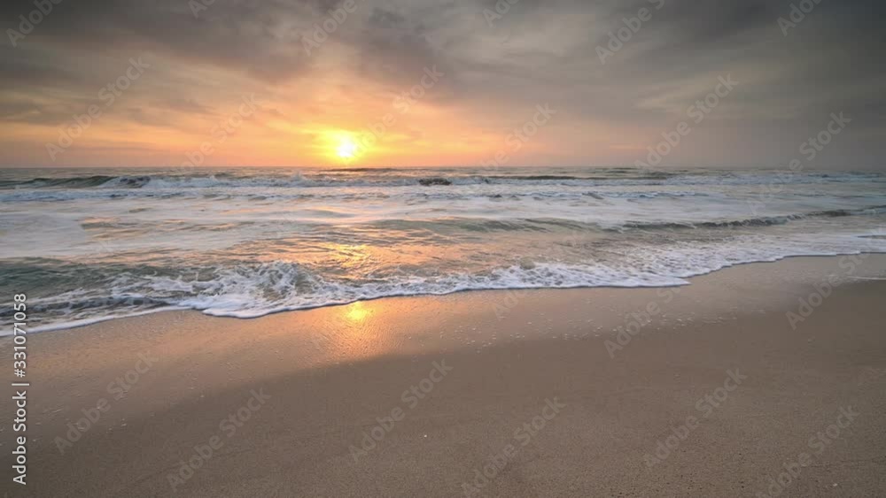 Video with colorful close up view of a sandy beach at sunrise Video with colorful close up view of a sandy beach at sunrise