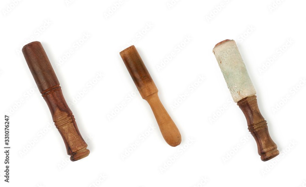 wooden clapper for singing bowls isolated on white background