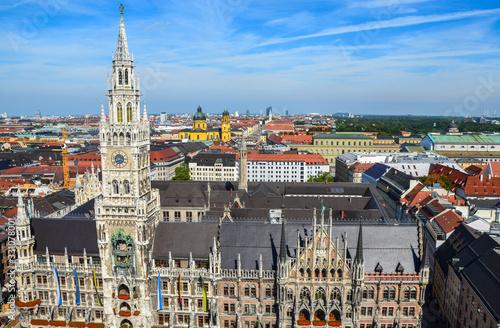 View of Munich city and New Town Hall Neues Rathaus. Mary's Square Marienplatz in the city center of the Bavarian capital with blue sky