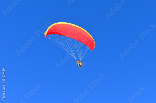 Ski gliding is extreme sport amounting to paragliding off mountain while skiing Etiquette needs to be observed when flying in resort as the majority don’t allow take off and land anywhere on the slope photo