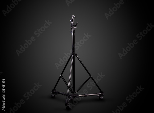Photo studio lighting stands isolated on the black background.