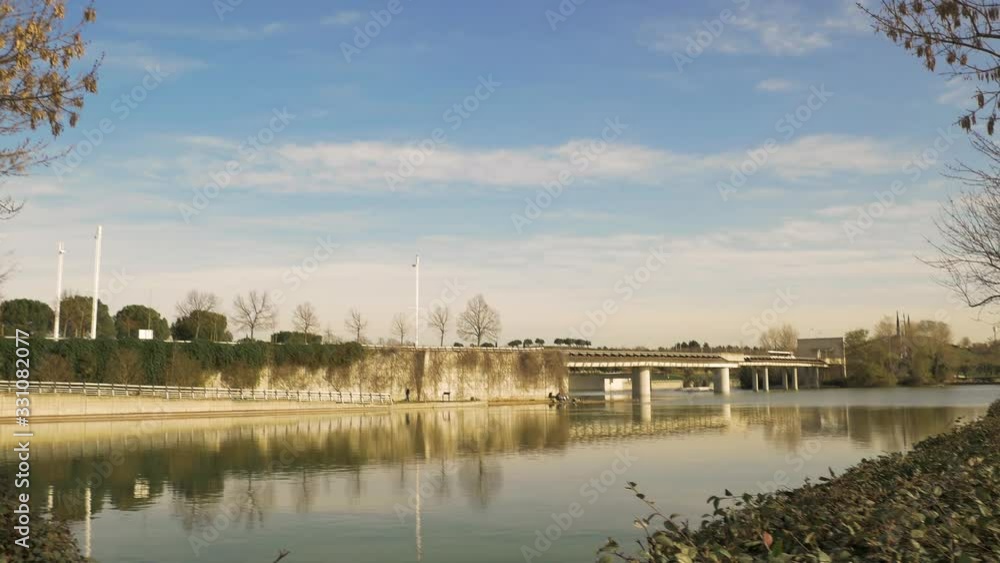 People enjoy outdoor sports and leisure activities early spring in an urban park in Madrid, Spain. A huge green park and recreational area with a train and sculptures for leisure and sport activities. People enjoy outdoor sports and leisure activities early spring in an urban park in Madrid, Spain. A huge green park and recreational area with a train and sculptures for leisure and sport activities.