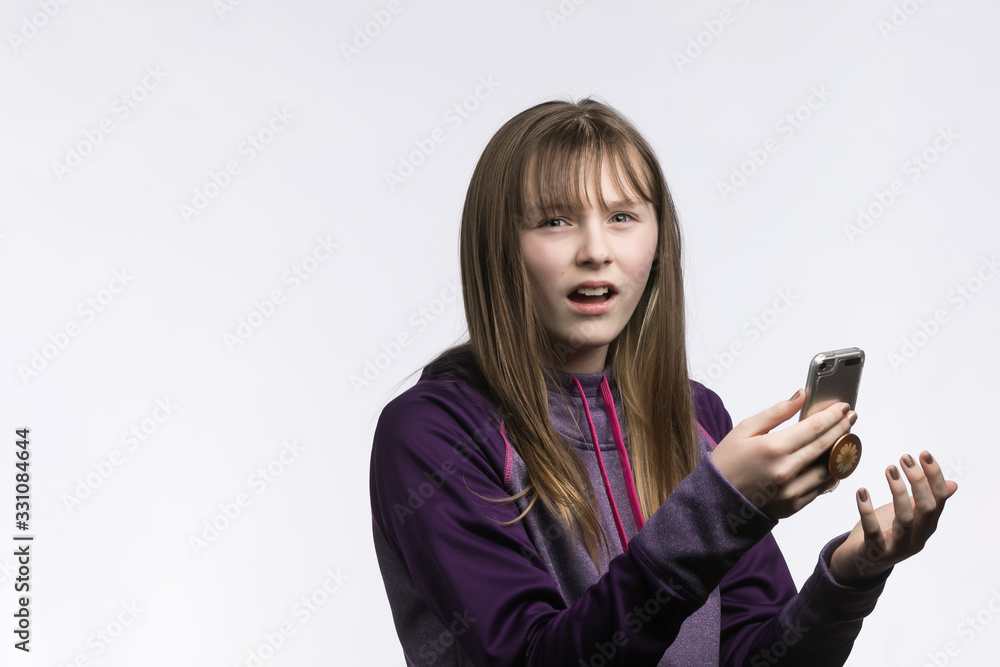 sporty young girl with attitude phone in hand sporty young girl with attitude phone in hand