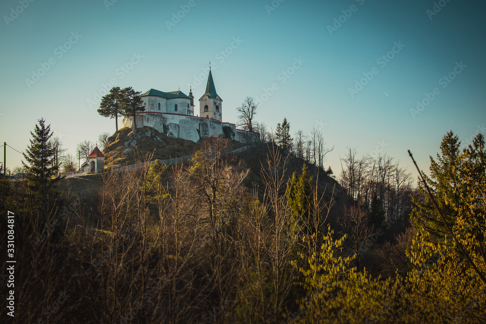 Church called Zasavska sveta gora, on a sunny winter day. Beautiful religious chuch on the top of the hill. Sinny day at the pilgrimage location.
