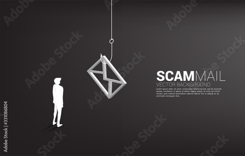 Silhouette of businessman standing with fishing hook with email icon. Concept of scam mail and phishing.