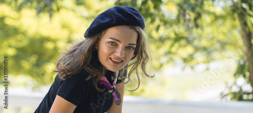 The girl in beret and skirt in the park, Cute girl portrait in french style