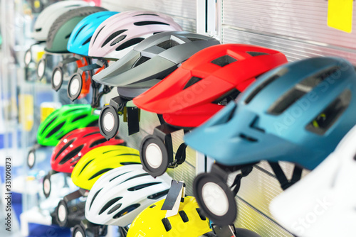 Bicycle helmets on the counter in the bike shop