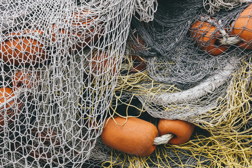 Pile of commercial fishing nets and gill nets on a fishing quay.,Seattle