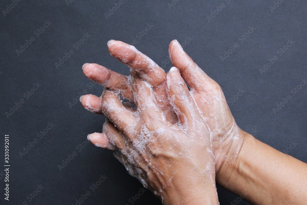 Fototapeta premium Washing hand with soap photo isolate on black top view copy space 