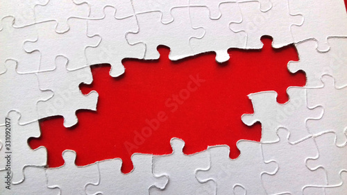 puzzle with missing pieces, space to write a message in red