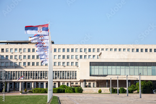 Flags of Serbia waiving in front of SIV, also known as Palata Srbija, or Palace of Serbia. It is the headquarters of the Serbian government, and the office of state administrations, in Belgrade photo