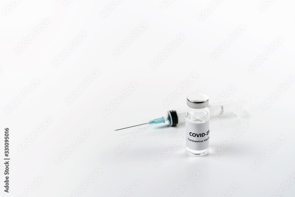 Bottle of corona virus COVID-19 vaccine. Coronavirus 2019-nCoV COVID concept. White background isolated with copyspace Bottle of corona virus COVID-19 vaccine. Coronavirus 2019-nCoV COVID concept. White background isolated with copyspace