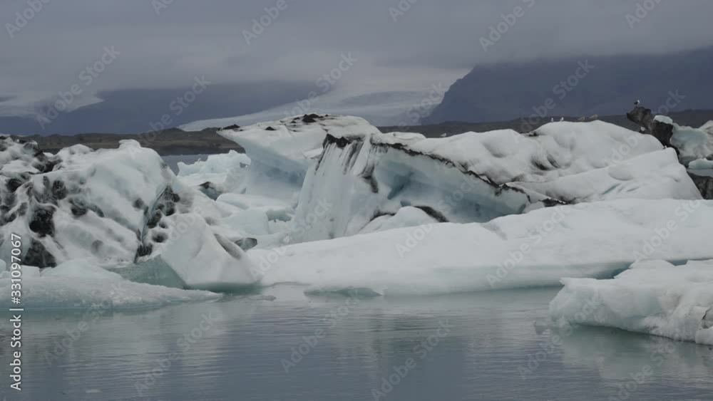 Icebergs floating in Jokulsarlon lagoon, summer landscape in Iceland. Icebergs floating in Jokulsarlon lagoon, summer landscape in Iceland.