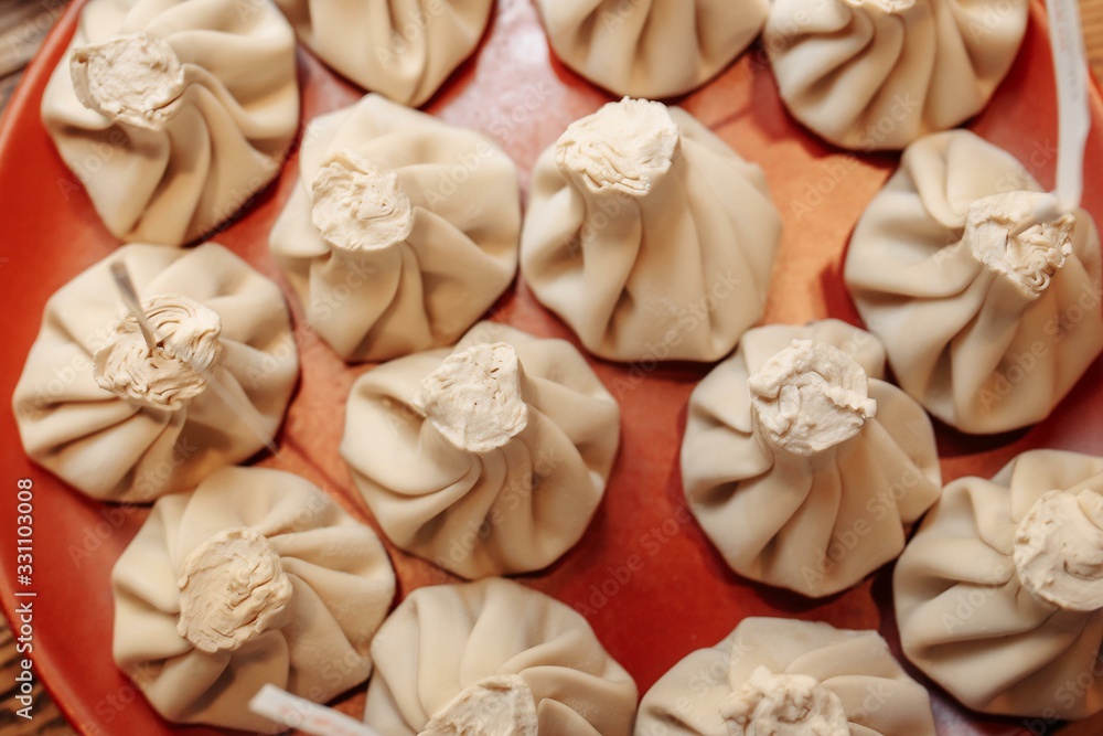 cooked khinkali on a clay plate cooked khinkali on a clay plate