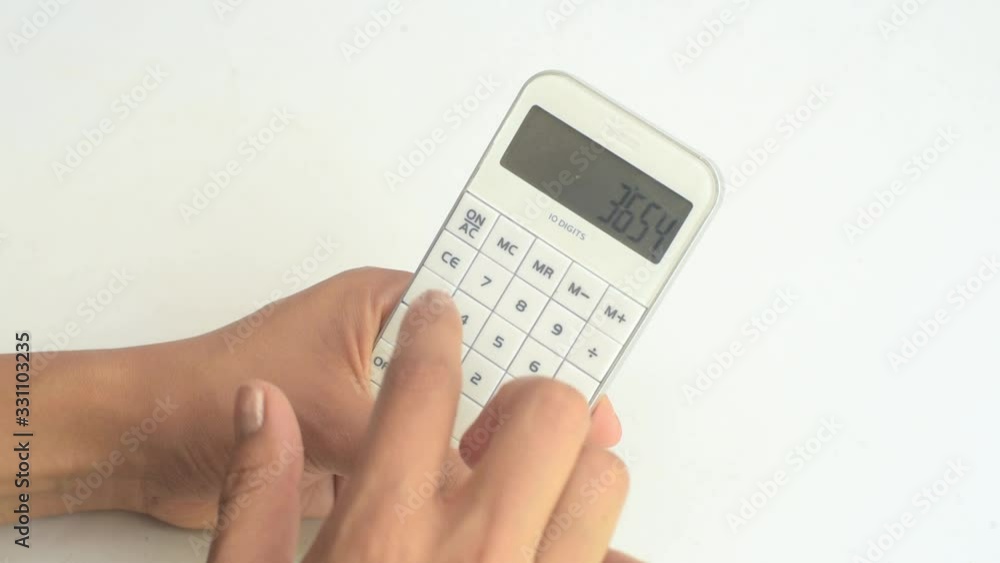 Hands woman typing on calculator Hands woman typing on calculator