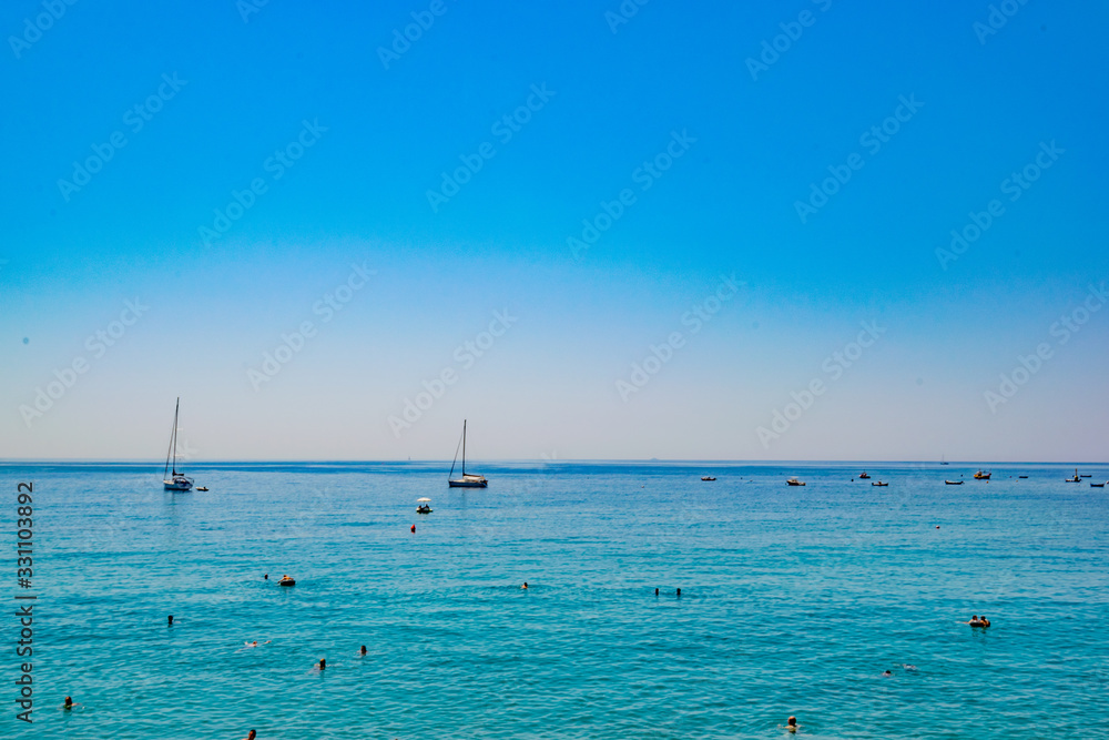 Boats at a calm sea in Cinque Terre Italy in a clean day Boats at a calm sea in Cinque Terre Italy in a clean day