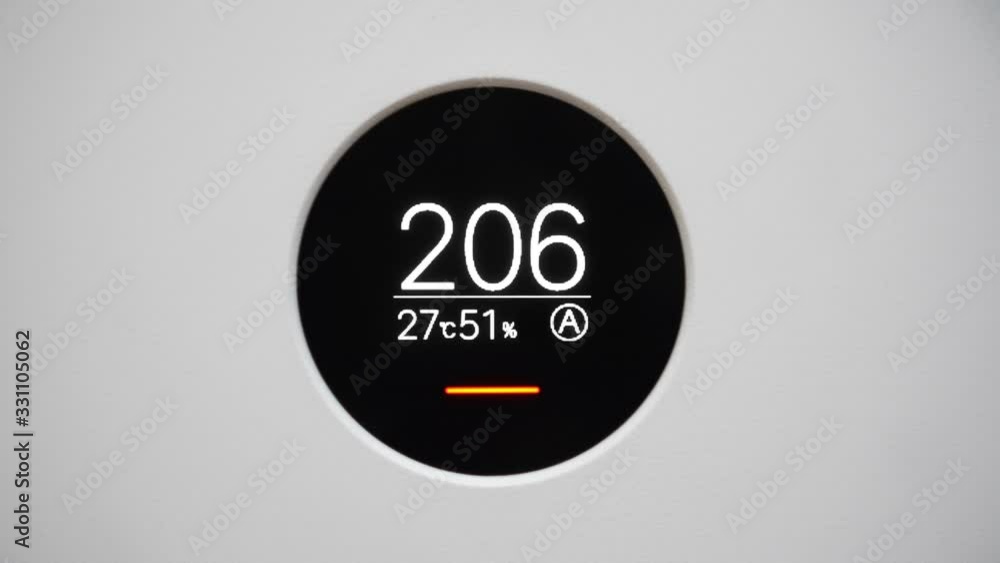Home air purifier with monitor screen show unhealthy air quality and air pollution levels , avoid all physical activity. Home air purifier with monitor screen show unhealthy air quality and air pollution levels , avoid all physical activity.