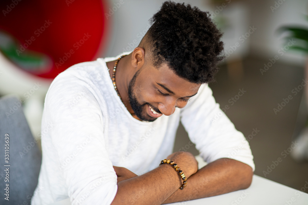 Obraz premium High angle view of smiling businessman sitting at desk in office